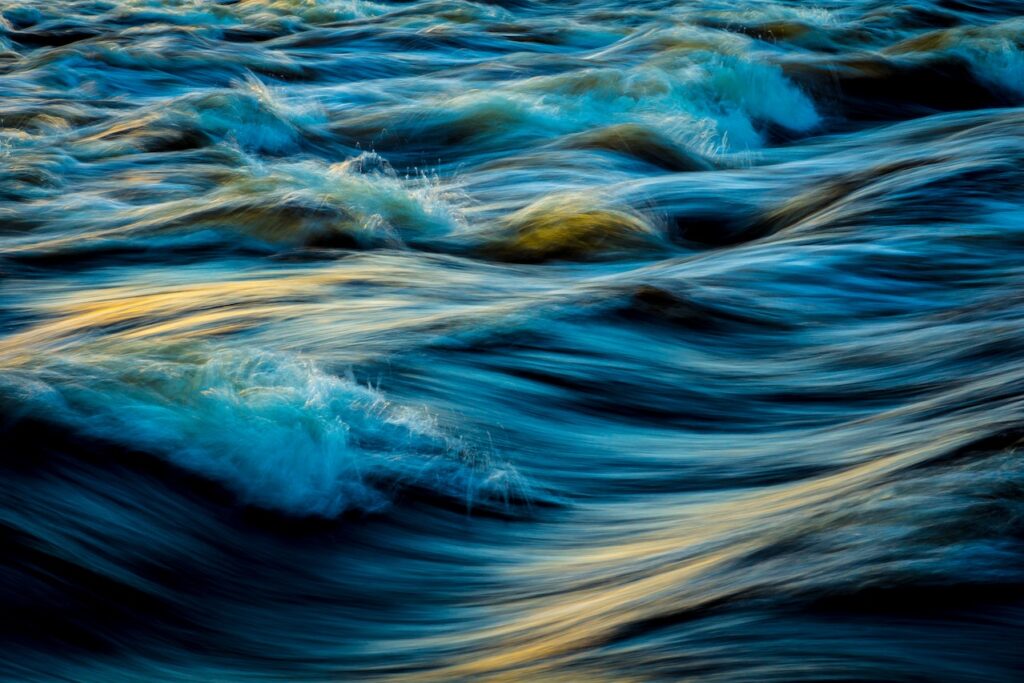 A very close up view of some water waves.
