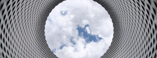 A circular window with a sky view in the center.